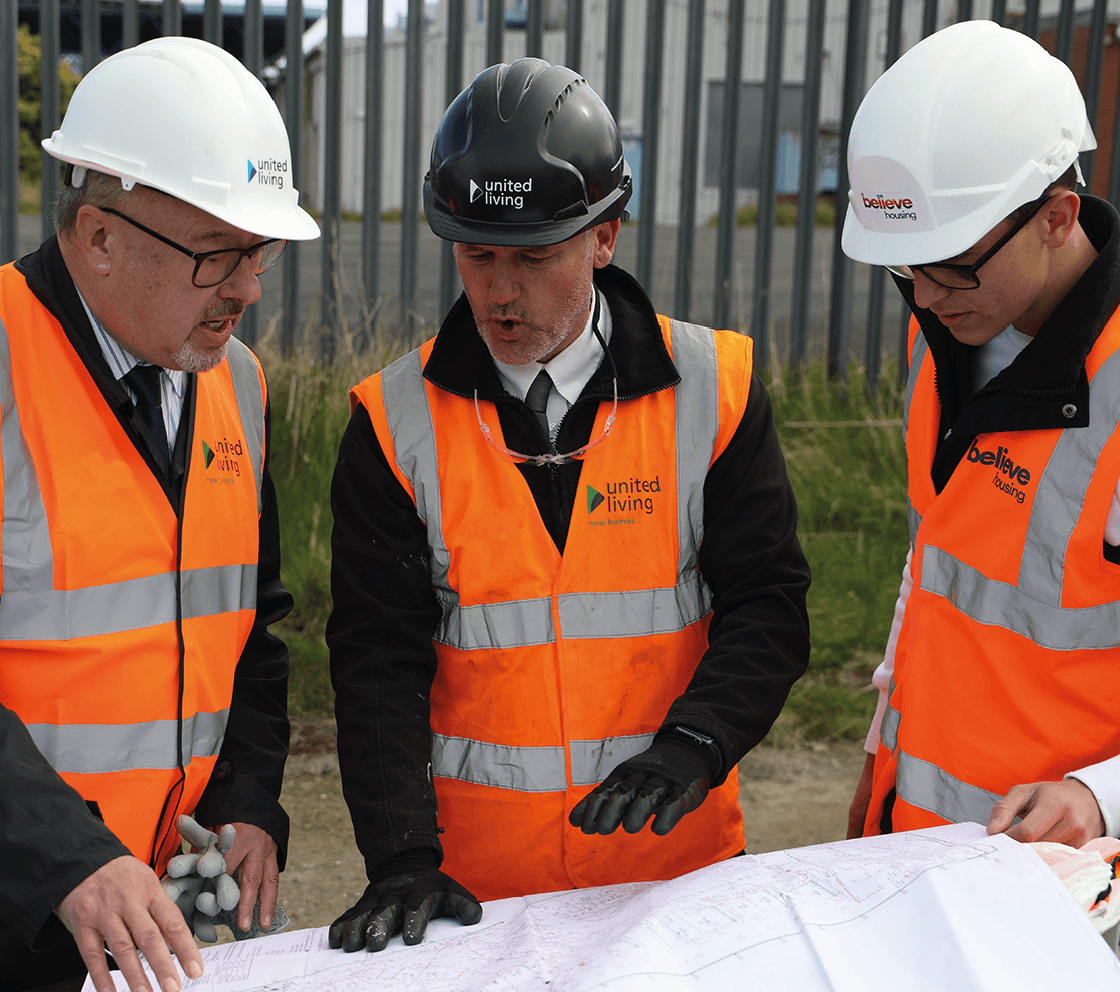 employees reviewing development plans