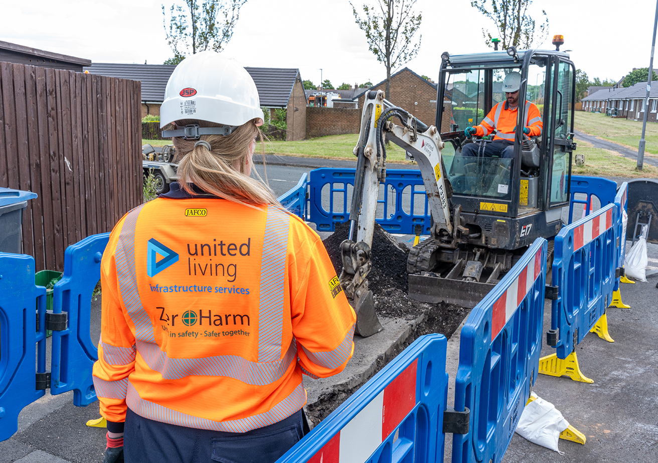 construction workers replacing underground pipes