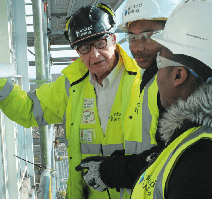 property services employees wearing hard hats and high vis jackets