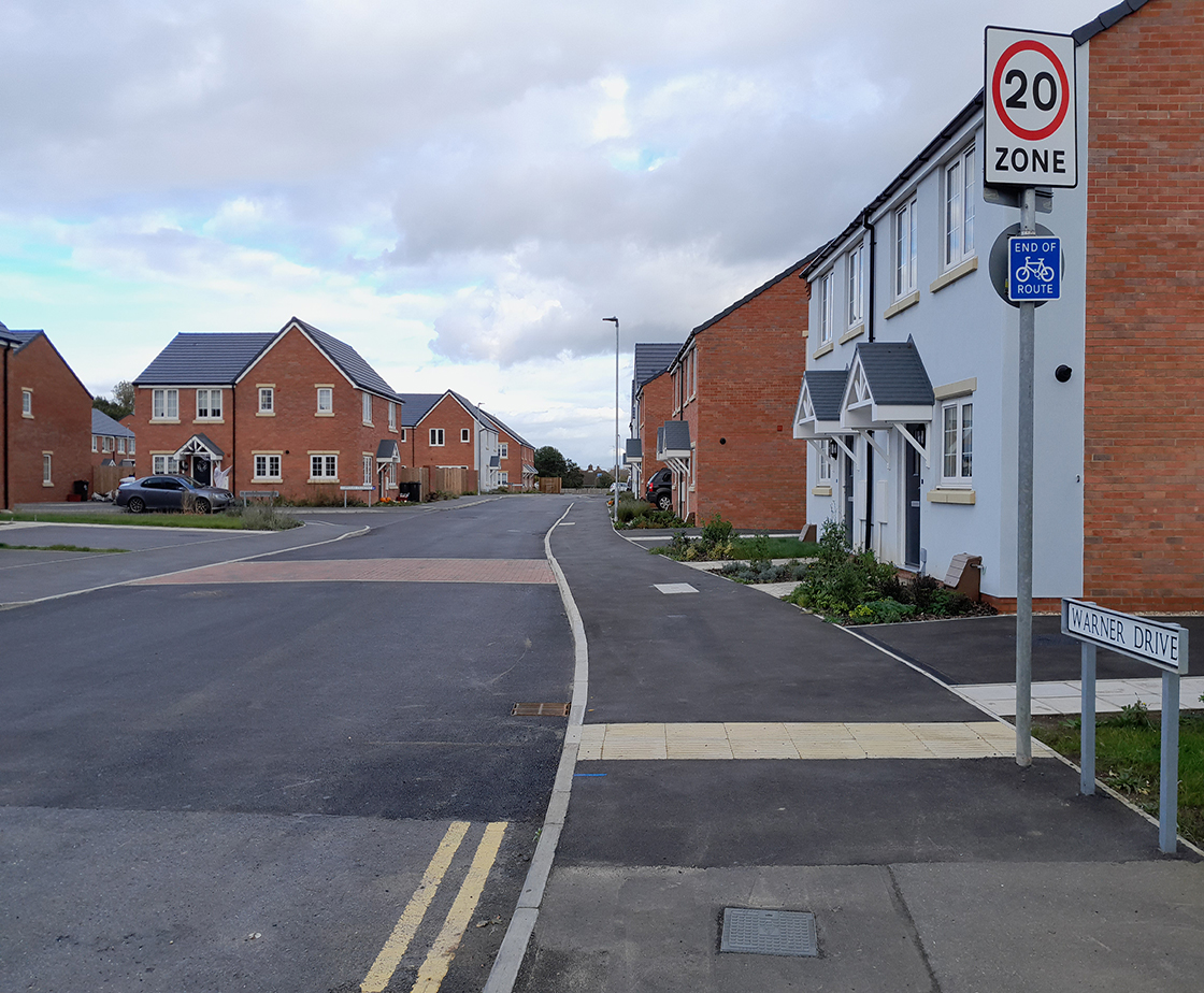 view of the street of new build home development