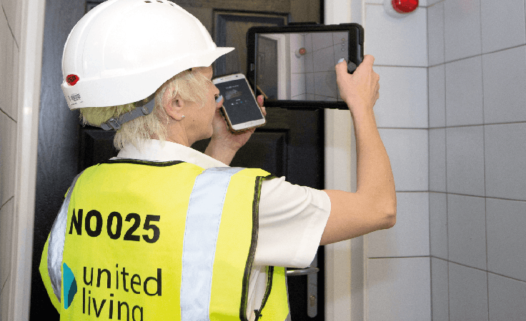 employee checking residential home for damp and mould
