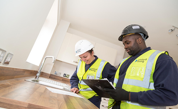 employees working in newly refurbished kitchen